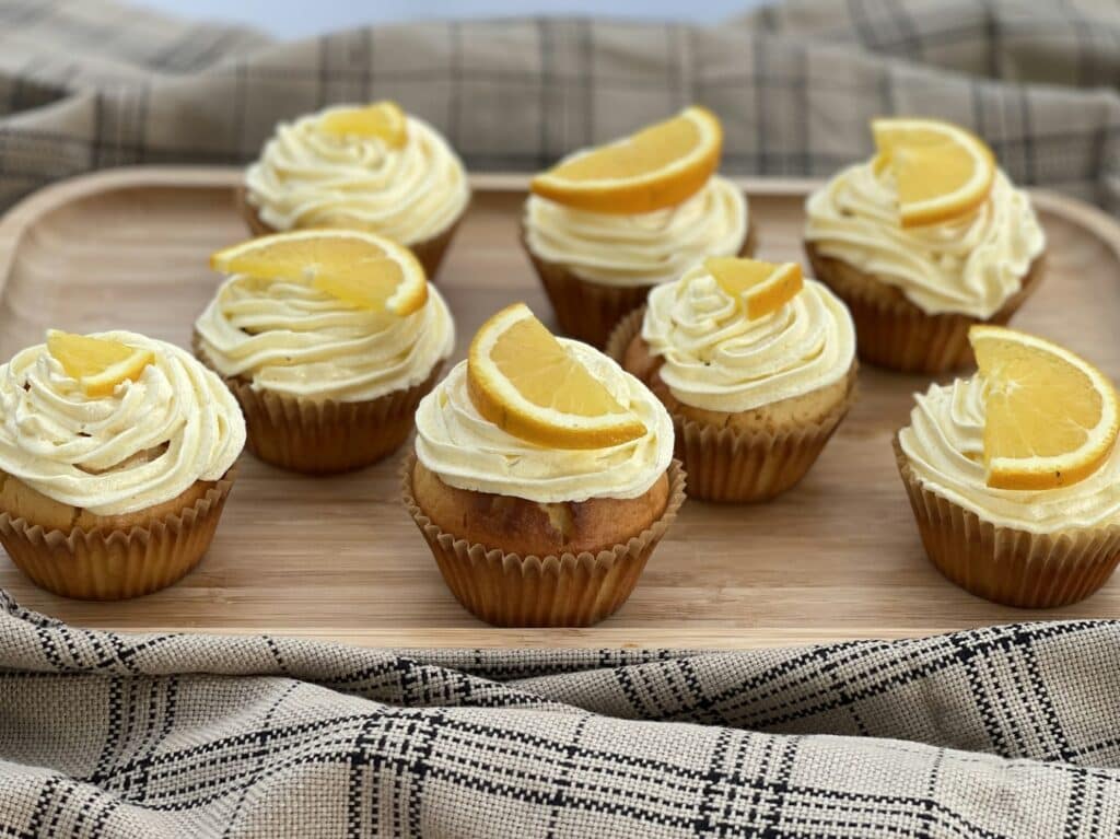 Homemade cupcakes with orange buttercream frosting
