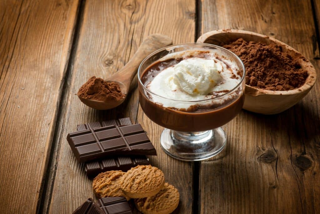 hot chocolate with whipped cream and cookies